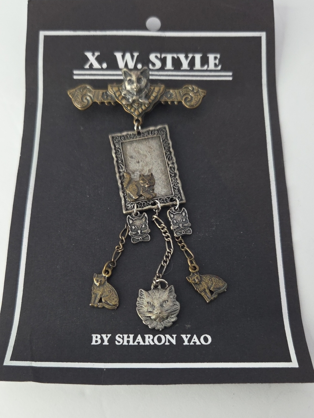 Vintage X.W. Style by Sharon Yao cat brooch featuring mixed pewter & brass Tone